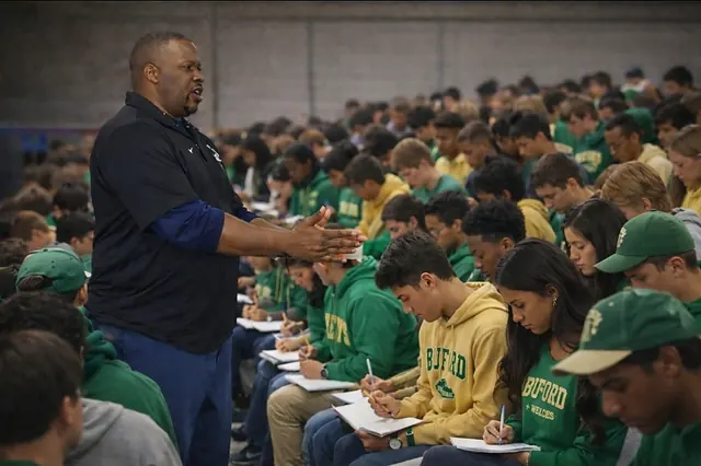 A Keys to the Journey school assembly, every student in the room taking notes