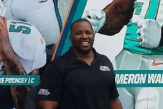 Kala Gause at Miami Dolphins training camp discussing Beyond Athletics