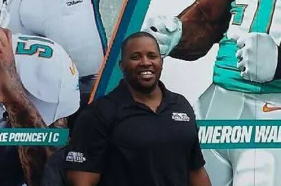 Kala Gause at Miami Dolphins training camp discussing Beyond Athletics