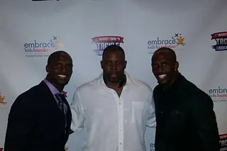 Kala Gause with Devin and Jason McCourty at the Tackle Sickle Cell event with the Embrace Kids Foundation
