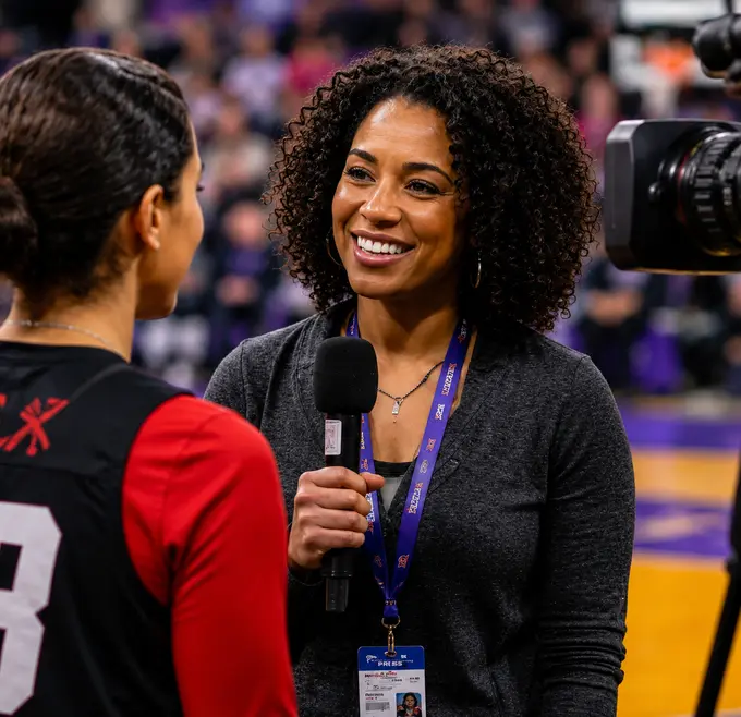 A reporter interviewing an athlete on the sideline