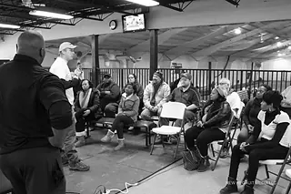 A room of parents listening at a Next Level and Beyond family meeting