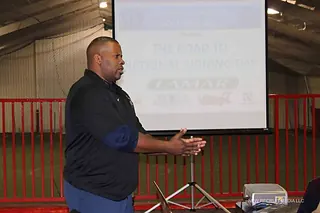 Kala Gause presenting The Road to National Signing Day to coaches, athletic directors, and counselors at a clinic